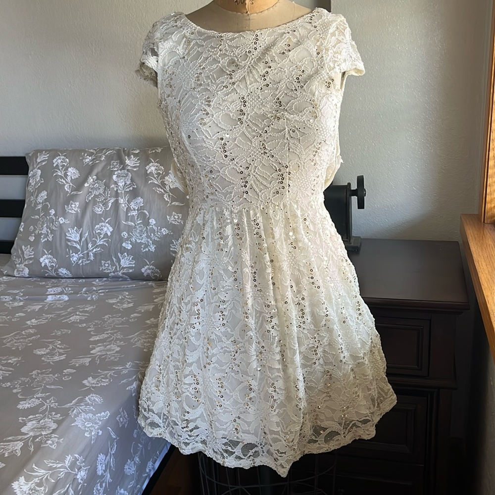 White lace dress with gold sequins